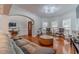 Spacious living room with hardwood floors, comfortable seating, and abundant natural light at 568 Musical Ct, Lawrenceville, GA 30044