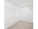 Walk-in closet with simple shelving at 5760 Tillman Way, Powder Springs, GA 30127
