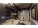 A vintage bathroom offers a bathtub with glass doors, a vanity with a mirror and sink, and ornate decorations at 2901 Briscoe Rd, Loganville, GA 30052