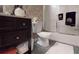 Simple bathroom with a vanity, toilet, and shower featuring neutral tones and clean lines at 2901 Briscoe Rd, Loganville, GA 30052