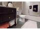 Bathroom with dark wood vanity, a frosted glass shower, and decorative towels that add a touch of elegance at 2901 Briscoe Rd, Loganville, GA 30052