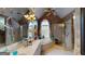 Lavish bathroom with a large bathtub, glass shower, and double vanity at 2901 Briscoe Rd, Loganville, GA 30052