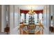 Cozy dining room with chandelier and bay windows at 2901 Briscoe Rd, Loganville, GA 30052