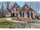 Inviting two-story stucco home featuring well-manicured landscaping and a charming entrance at 2901 Briscoe Rd, Loganville, GA 30052