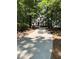 Traditional two-story home boasts a lush green lawn and a long driveway, nestled in a mature wooded setting at 2901 Briscoe Rd, Loganville, GA 30052
