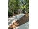 Traditional home features a long driveway, complemented by lush greenery and mature trees at 2901 Briscoe Rd, Loganville, GA 30052