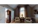 Cozy sitting room featuring elegant decor, a large window, and comfortable seating at 2901 Briscoe Rd, Loganville, GA 30052