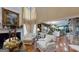 Bright living room with a fireplace, large windows, and access to the kitchen at 2901 Briscoe Rd, Loganville, GA 30052
