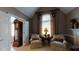 Comfortable living room with natural light, armchairs, and a fireplace at 2901 Briscoe Rd, Loganville, GA 30052