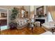 Inviting living room with hardwood floors, fireplace, and high ceilings at 2901 Briscoe Rd, Loganville, GA 30052
