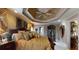Luxurious main bedroom with a tray ceiling, a large bed, and decorative furnishings at 2901 Briscoe Rd, Loganville, GA 30052