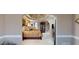 Main bedroom featuring a tray ceiling, plush carpet, and elegant decor at 2901 Briscoe Rd, Loganville, GA 30052