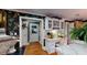 Cozy office space featuring custom built-ins, decorative wallpaper, and hardwood floors at 2901 Briscoe Rd, Loganville, GA 30052