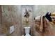 Detailed half bath with decorative walls, gold fixtures, and a statement towel rack at 2901 Briscoe Rd, Loganville, GA 30052