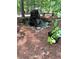 Beautiful water feature with mature trees, a stone surround, and flourishing green ground cover at 2901 Briscoe Rd, Loganville, GA 30052