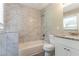 Bathroom features marble tile, a tub, and a granite sink at 2957 Browns Mill Se Rd, Atlanta, GA 30354