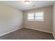 Comfortable bedroom with neutral paint and carpet, and natural light at 2957 Browns Mill Se Rd, Atlanta, GA 30354