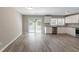 Spacious kitchen features white cabinets, granite countertops, stainless appliances and sliding glass doors at 2957 Browns Mill Se Rd, Atlanta, GA 30354