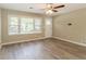Inviting living room with large windows, new flooring and fresh paint at 2957 Browns Mill Se Rd, Atlanta, GA 30354