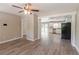 Open-concept living space showcasing the new floors, paint and flow into the kitchen at 2957 Browns Mill Se Rd, Atlanta, GA 30354