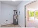 Utility room featuring a water heater and plank flooring at 2957 Browns Mill Se Rd, Atlanta, GA 30354