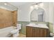 Bathroom featuring tub with tile surround, modern vanity with large mirror at 355 Winding River Dr # B, Atlanta, GA 30350