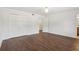 Spacious bedroom with hardwood floors, white walls, and a closet at 355 Winding River Dr # B, Atlanta, GA 30350