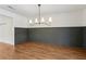 Dining room with modern lighting and views to outdoors from french doors at 355 Winding River Dr # B, Atlanta, GA 30350