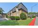 Apartment building featuring brick facade, mature landscaping and on-site parking at 355 Winding River Dr # B, Atlanta, GA 30350
