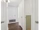 Hallway with white doors and brown flooring and gray accent wall at 355 Winding River Dr # B, Atlanta, GA 30350