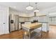 Well-lit kitchen featuring stainless steel appliances, white tile backsplash, and wood island at 355 Winding River Dr # B, Atlanta, GA 30350