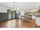 Spacious kitchen and dining area with stainless steel appliances and modern lighting at 355 Winding River Dr # B, Atlanta, GA 30350