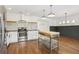 Spacious kitchen with white cabinets, stainless steel appliances, and wood island at 355 Winding River Dr # B, Atlanta, GA 30350