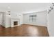 Living room features a decorative fireplace, recessed lights, hardwood floors and white walls at 355 Winding River Dr # B, Atlanta, GA 30350