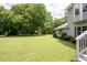 Grassy backyard with mature trees, providing a serene and private outdoor space at 76 Vaughn Ne Rd, Cartersville, GA 30121