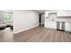 Finished basement features a partial kitchen and large living area with modern flooring and finishes at 76 Vaughn Ne Rd, Cartersville, GA 30121