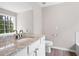 Bathroom featuring granite countertop vanity, toilet, and large mirror at 76 Vaughn Ne Rd, Cartersville, GA 30121