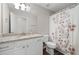 Bathroom with granite countertop vanity and shower with curtain at 76 Vaughn Ne Rd, Cartersville, GA 30121