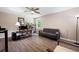 Bedroom with ceiling fan, hardwood floors, and a comfortable sitting area creates a peaceful retreat at 76 Vaughn Ne Rd, Cartersville, GA 30121