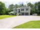 Charming two-story home features a spacious driveway and attached two-car garage at 76 Vaughn Ne Rd, Cartersville, GA 30121