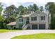 Charming home featuring a two-car garage, stone accents, bay window, and a welcoming entrance at 76 Vaughn Ne Rd, Cartersville, GA 30121