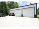 Detached shop with three garage doors, with ample space for parking and storage at 76 Vaughn Ne Rd, Cartersville, GA 30121