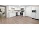 Basement kitchen with stainless appliances and white cabinetry at 76 Vaughn Ne Rd, Cartersville, GA 30121