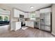 Well-lit kitchen featuring stainless steel appliances, white cabinets, and modern countertops at 76 Vaughn Ne Rd, Cartersville, GA 30121