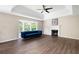 Spacious living room featuring a fireplace, modern flooring, and a large bay window at 76 Vaughn Ne Rd, Cartersville, GA 30121