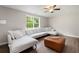 Spacious living room features modern vinyl flooring, a large window, and a large sectional couch at 76 Vaughn Ne Rd, Cartersville, GA 30121