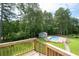 Aerial view of a backyard featuring an in-ground pool, mature trees, and a fenced yard at 76 Vaughn Ne Rd, Cartersville, GA 30121