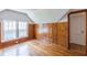 Bedroom with a cool retro vibe with hardwood floors, knotty pine walls, and dormer windows at 1391 Jefferson Ave, East Point, GA 30344