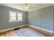 Bedroom with hardwood floors, a ceiling fan, natural light and neutral wall colors at 1391 Jefferson Ave, East Point, GA 30344