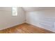 Upstairs bedroom with hardwood floors, and a built in set of drawers at 1391 Jefferson Ave, East Point, GA 30344